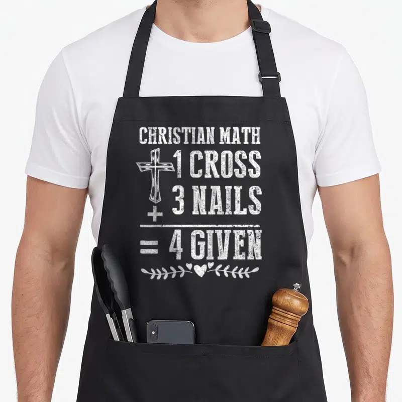 Math christian apron - White distressed text 1 Cross 3 Nails 4 Given with cross and vine graphic — shown on a black cotton canvas apron against a white background