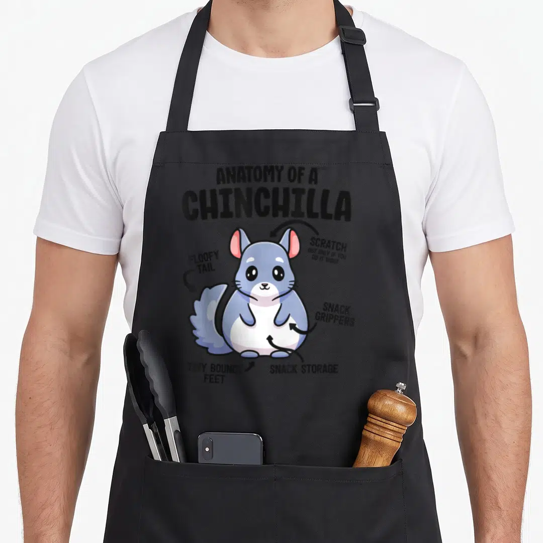 Chinchilla anatomy apron - Cartoon chinchilla diagram labeling snack grippers, floofy tail, and bouncy feet in blue — shown on a black cotton canvas apron against a white background