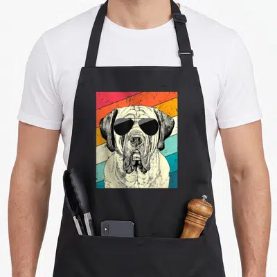 Mastiff sunglass dog apron - Retro mastiff wearing sunglasses against red orange yellow teal cream diagonal stripes — shown on a black cotton canvas apron against a white background