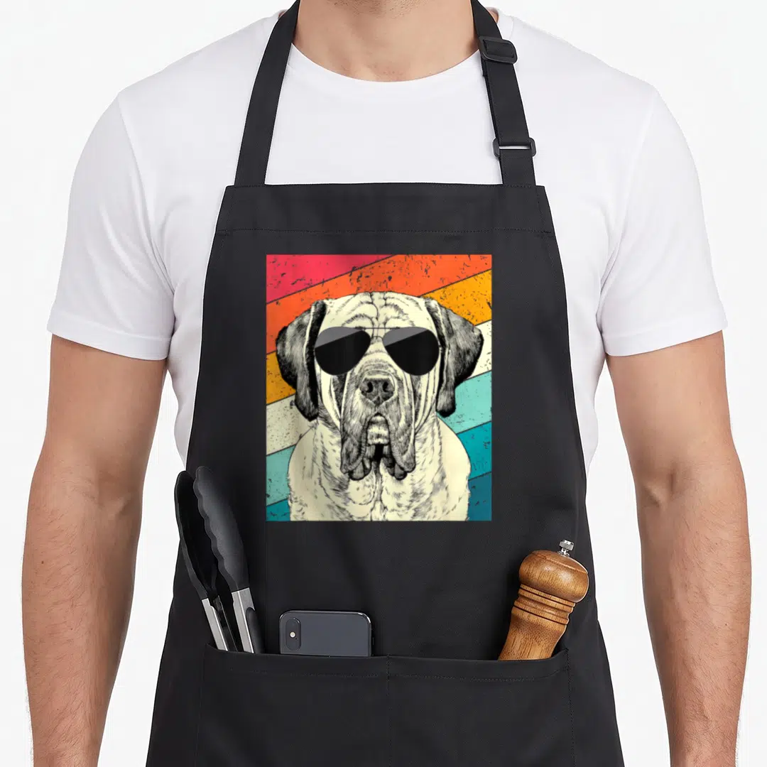 Mastiff sunglass dog apron - Retro mastiff wearing sunglasses against red orange yellow teal cream diagonal stripes — shown on a black cotton canvas apron against a white background