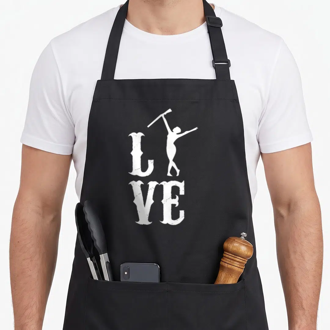 Rifle color guard apron - White LIVE text with woman silhouette holding rifle aloft replacing the letter I — shown on a black cotton canvas apron against a white background