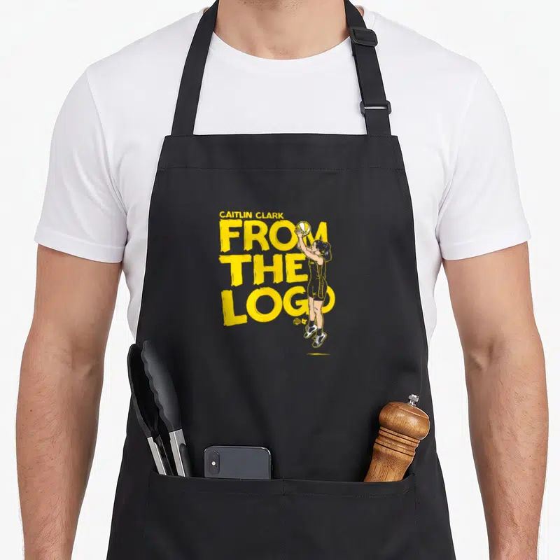 Basketball clarks apron - Yellow text CAITLIN CLARK FROM THE LOGO with cartoon player standing and shooting basketball — shown on a black cotton canvas apron against a white background