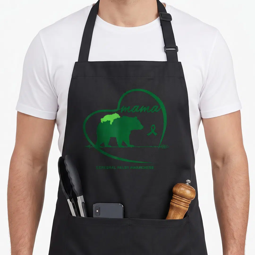Ribbon mama bear apron - Green heart with bear, cub, ribbon, and Cerebral Palsy Awareness text — shown on a black cotton canvas apron against a white background