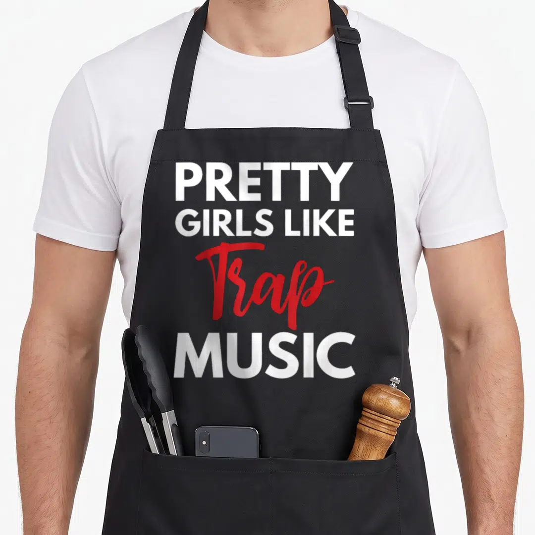 Music pretty apron - Stacked white and red text reading PRETTY GIRLS LIKE Trap MUSIC — shown on a black cotton canvas apron against a white background