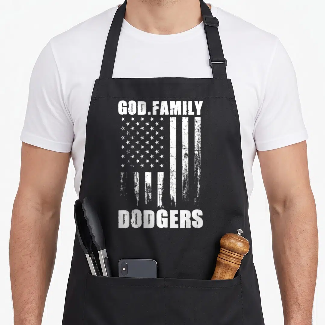 God dodger apron - Distressed white flag with GOD.FAMILY and DODGERS text in white block letters — shown on a black cotton canvas apron against a white background