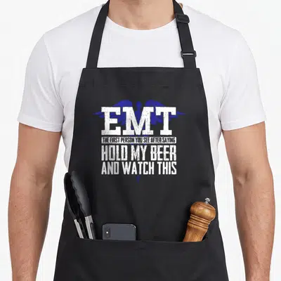 Emt joke apron - Distressed blue caduceus behind white EMT text and sarcastic quote — shown on a black cotton canvas apron against a white background