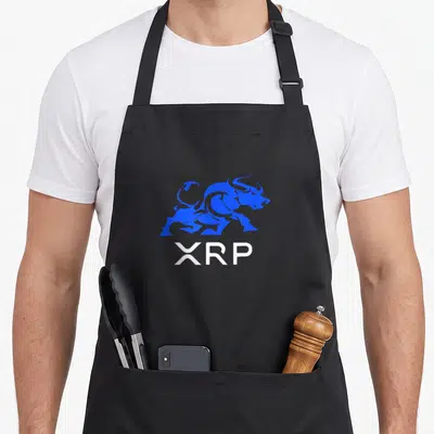 Xrp crypto apron - Blue bull silhouette above white XRP text on black fabric — shown on a black cotton canvas apron against a white background