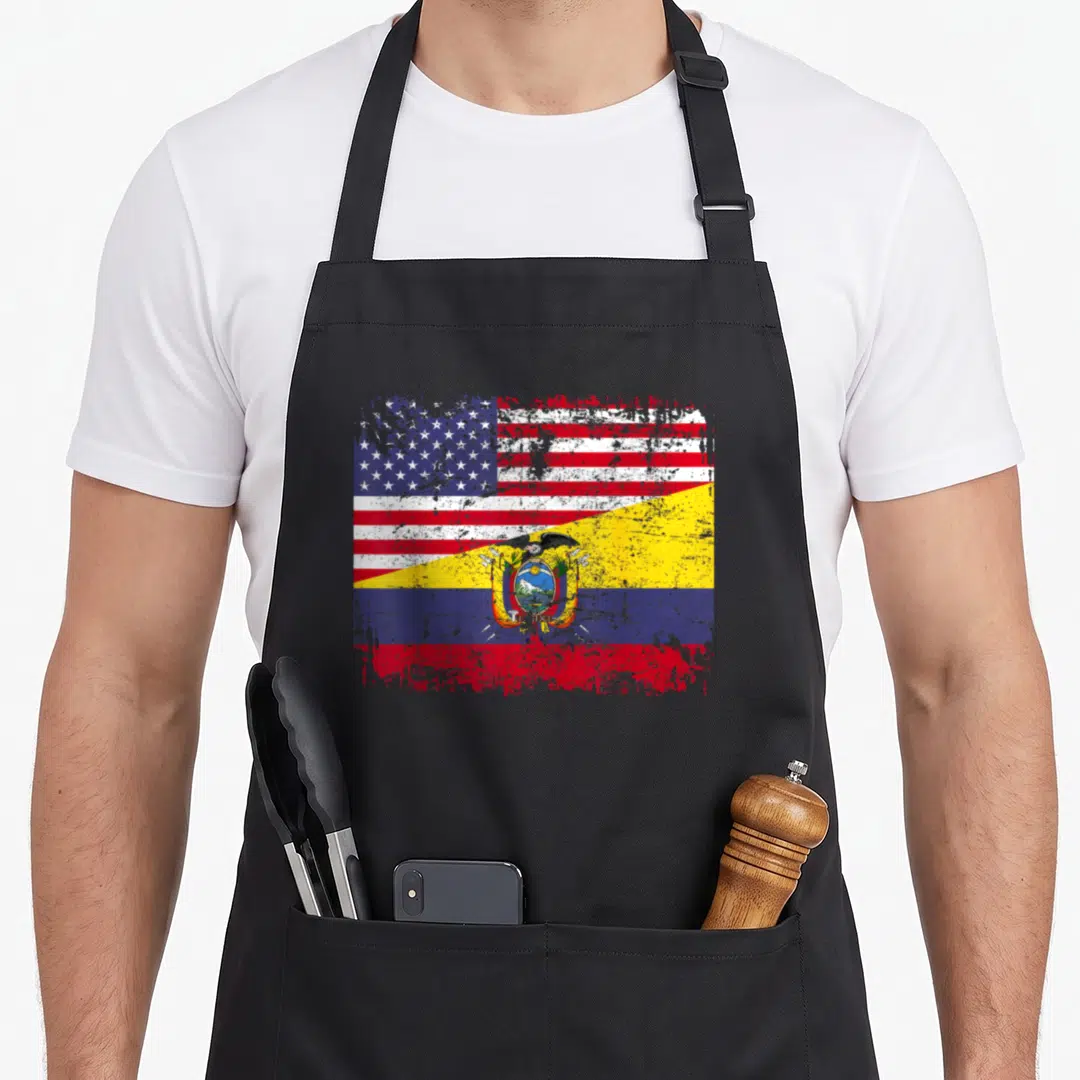 Ecuadorian american flag apron - Two flags merged diagonally in red white blue and yellow with distressed texture — shown on a black cotton canvas apron against a white background