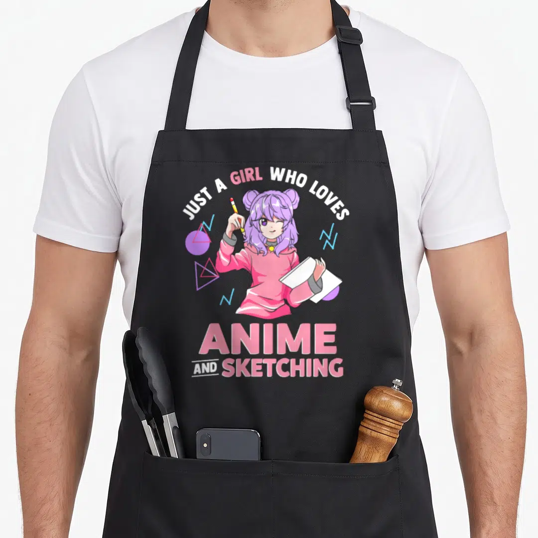 Funny drawing anime apron - Cartoon girl holding pencil and sketchbook surrounded by pink and purple geometric shapes — shown on a black cotton canvas apron against a white background