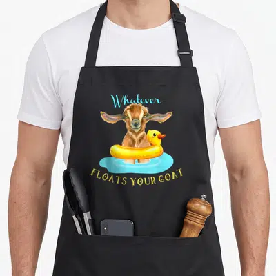 Float goat apron - Brown goat in yellow duck floatie with light blue water and arched text — shown on a black cotton canvas apron against a white background