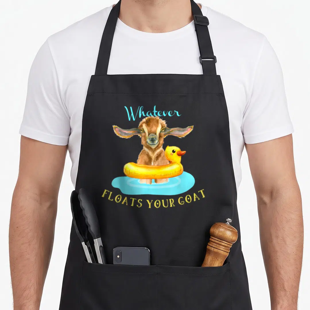 Float goat apron - Brown goat in yellow duck floatie with light blue water and arched text — shown on a black cotton canvas apron against a white background