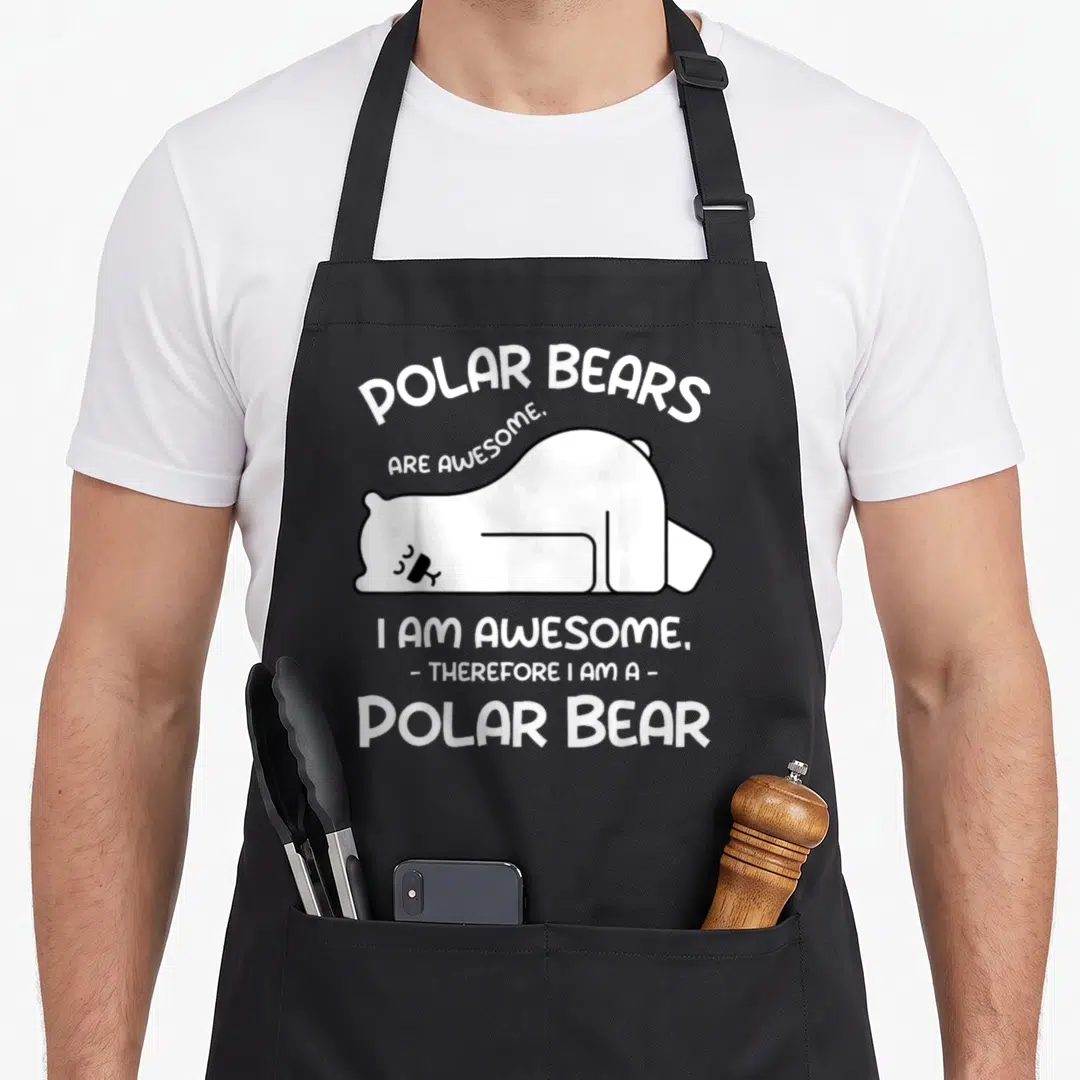 Arctic animal bear apron - White cartoon polar bear lying down with text 'Polar Bears Are Awesome. I Am Awesome.' — shown on a black cotton canvas apron against a white background