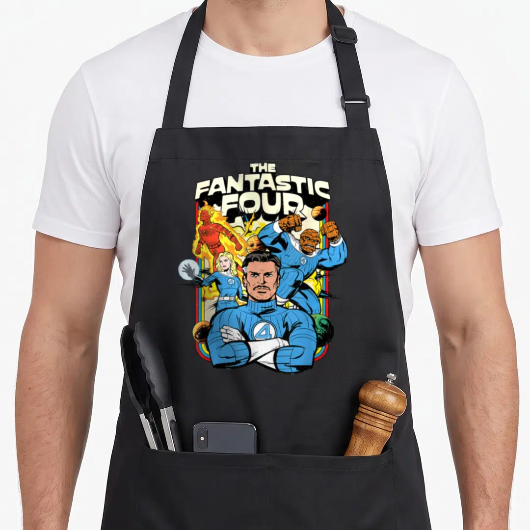 Fantastic step apron - Retro cartoon print of four superheroes in blue suits with stacked white title text — shown on a black cotton canvas apron against a white background