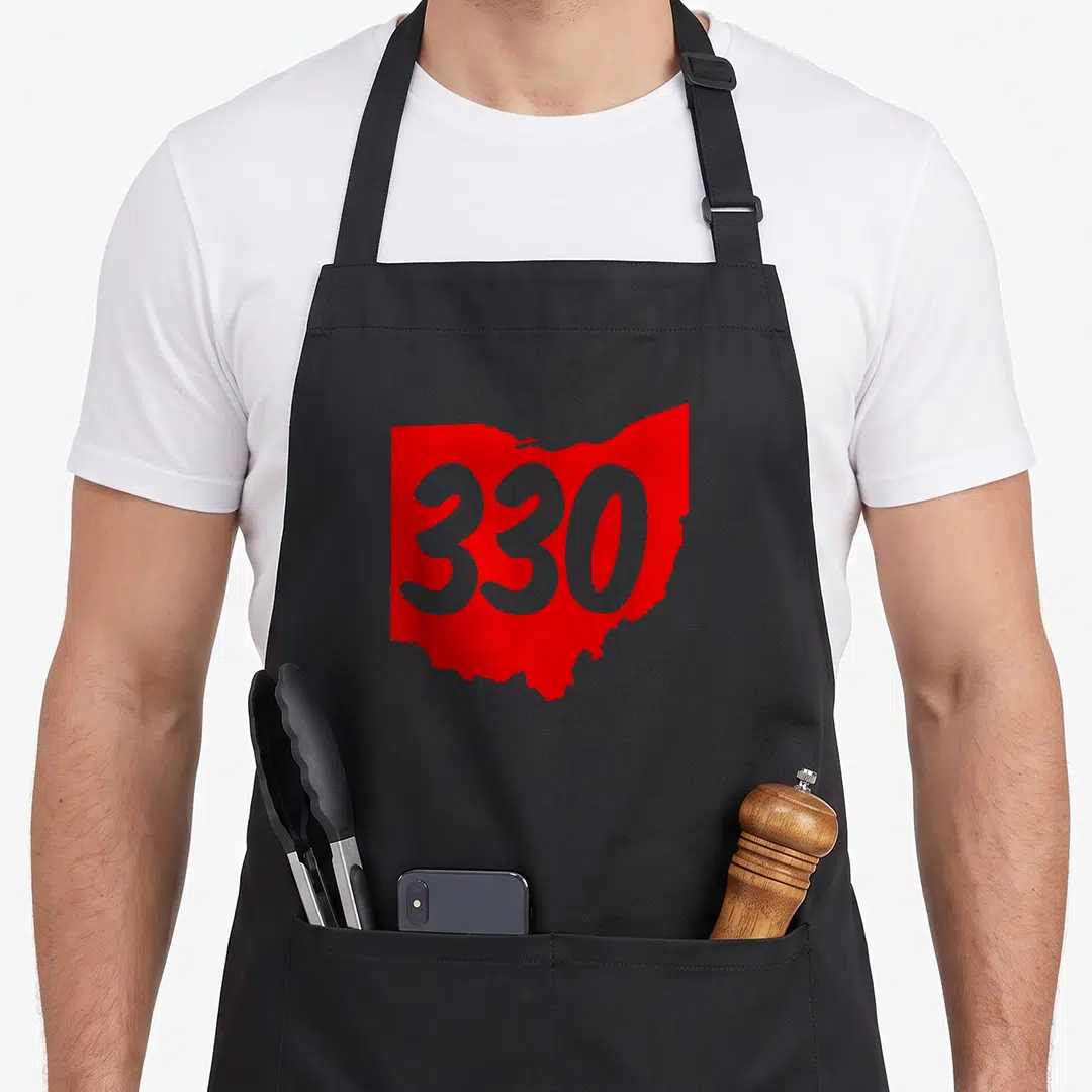 Akron youngstown apron - Red Ohio state silhouette with grey 330 number centered on front panel — shown on a black cotton canvas apron against a white background