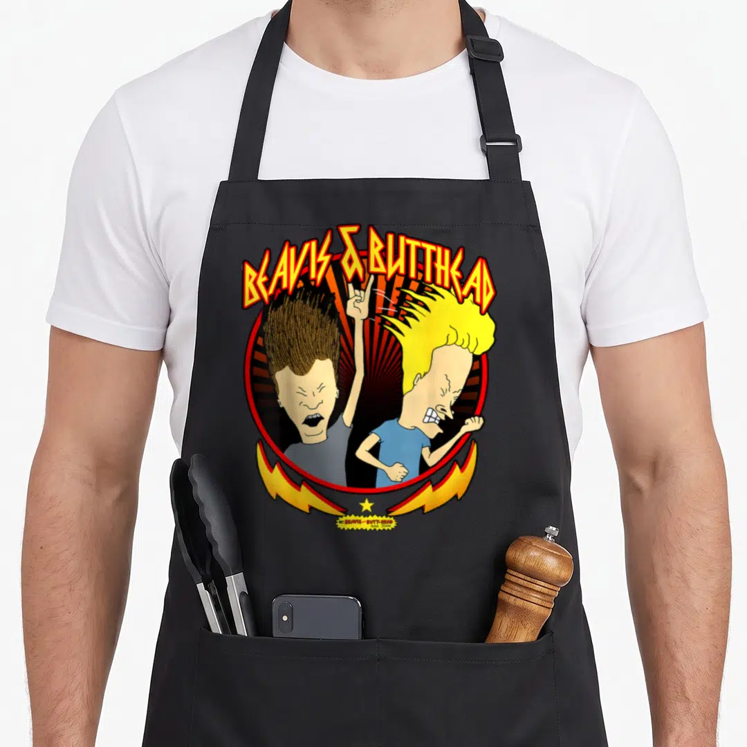 Beavis butt apron - Beavis and Butt-Head logo with red sunburst and yellow lightning bolts — shown on a black cotton canvas apron against a white background