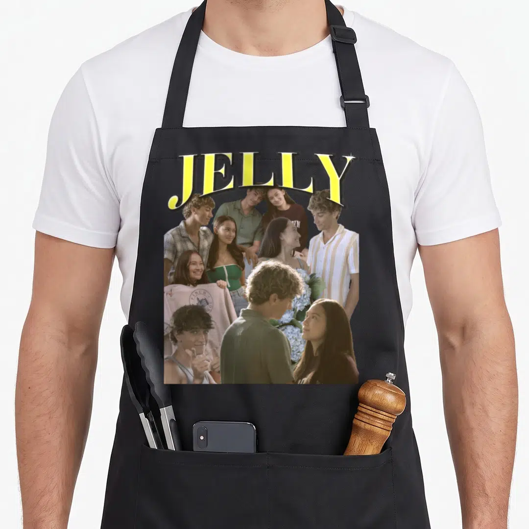 Jelly pretty apron - JELLY in yellow over collage of young people and blue flower bouquet — shown on a black cotton canvas apron against a white background