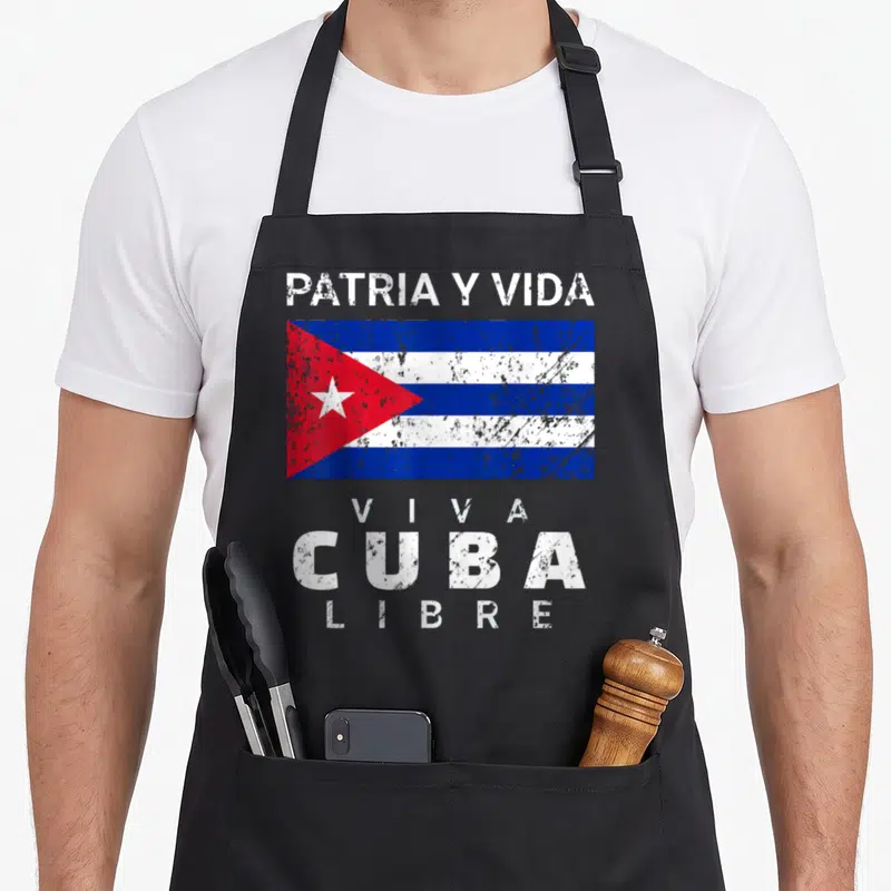 Viva distressed apron - Cuba flag with distressed PATRIA Y VIDA and VIVA CUBA LIBRE text — shown on a black cotton canvas apron against a white background