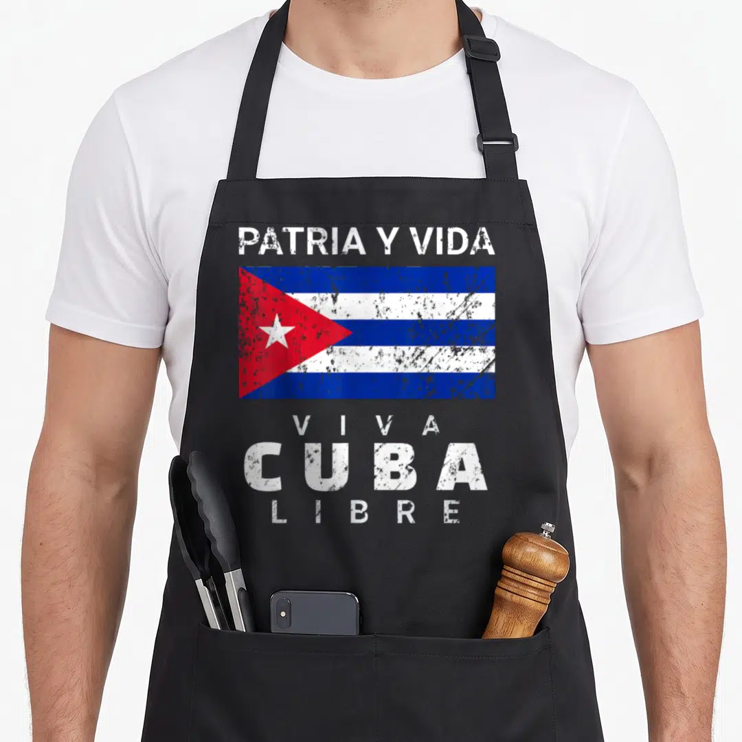 Viva distressed apron - Cuba flag with distressed PATRIA Y VIDA and VIVA CUBA LIBRE text — shown on a black cotton canvas apron against a white background