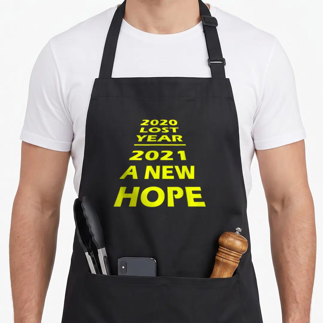 Lost hope apron - Stacked yellow text reading 2020 Lost Year 2021 A New Hope — shown on a black cotton canvas apron against a white background