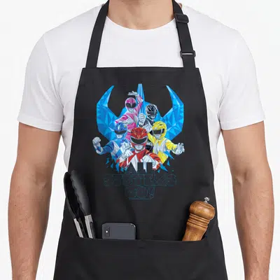 Helmet rangers apron - Five polygon Power Rangers in red yellow pink blue black with All Systems Go text — shown on a black cotton canvas apron against a white background