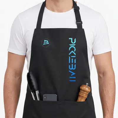 Distressed pickleball apron - Vertical PICKLEBALL text in blue gradient next to a circular logo reading Lifestyle Brand — shown on a black cotton canvas apron against a white background