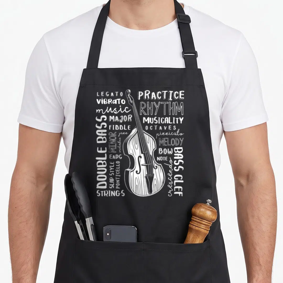 Instrument double apron - White line art double bass with surrounding music terms like Legato, Vibrato, Bass Clef — shown on a black cotton canvas apron against a white background
