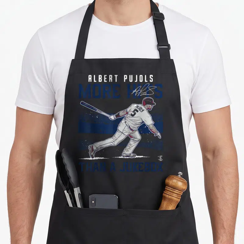 Albert mvp apron - Albert Pujols batting stance with More Hits Than A Jukebox text in navy and white distressed print — shown on a black cotton canvas apron against a white background