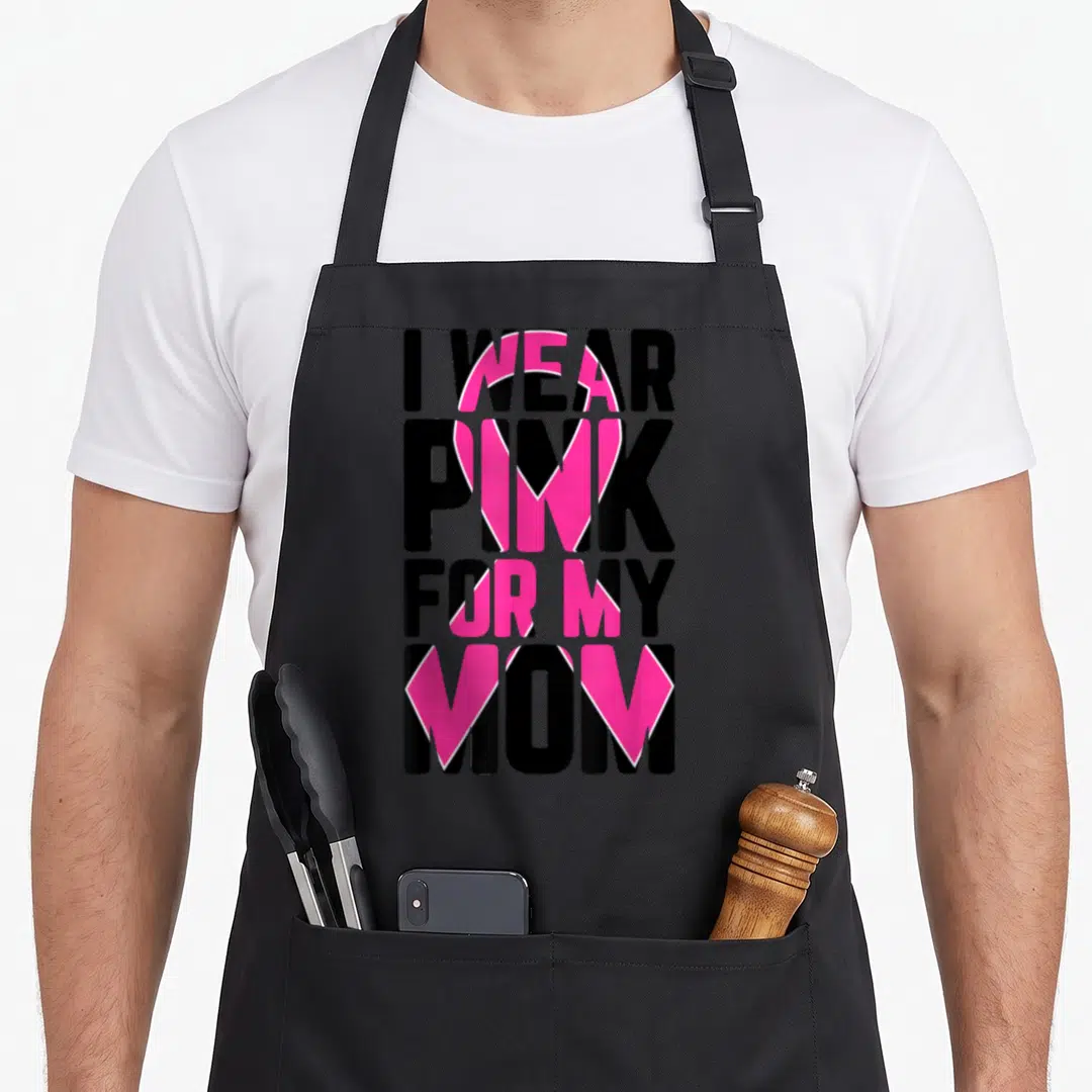 Supporter breast cancer awareness aprons - I WEAR PINK FOR MY MOM text with pink ribbon overlay — shown on a black cotton canvas apron against a white background