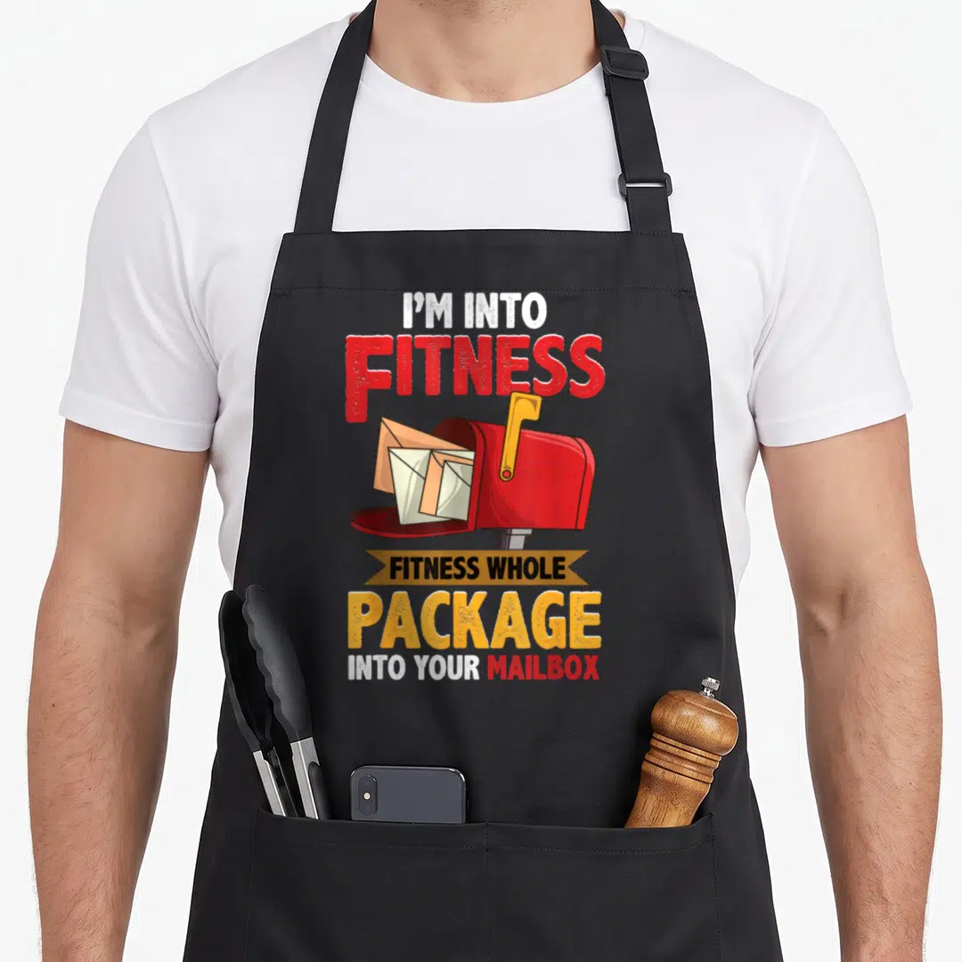 Mailman postal aprons - Red mailbox with envelopes and text I'm Into Fitness Whole Package Into Your Mailbox — shown on a black cotton canvas apron against a white background