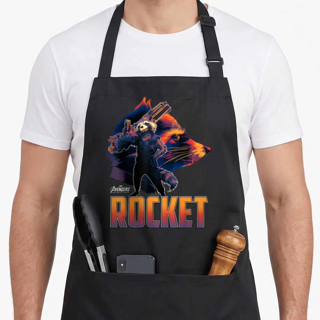 Guardian infinity apron - Rocket Raccoon full body figure holding gun in front of profile head with ROCKET text below — shown on a black cotton canvas apron against a white background