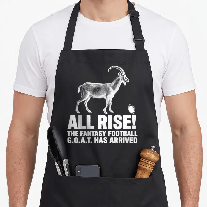 League goat apron - White distressed goat and text ALL RISE THE FANTASY FOOTBALL G.O.A.T. HAS ARRIVED — shown on a black cotton canvas apron against a white background