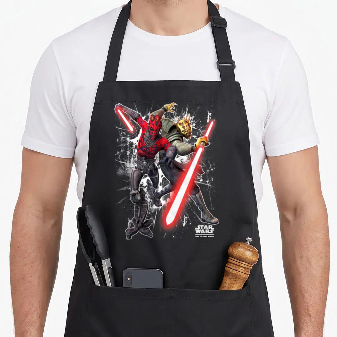 Maul savage apron - Darth Maul and Savage Opress fighting with red lightsabers and Clone Wars logo — shown on a black cotton canvas apron against a white background