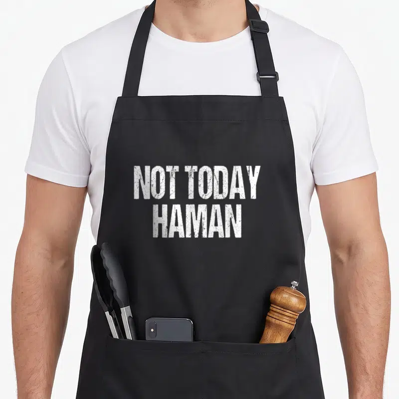 Haman not today apron - White distressed text reading NOT TODAY HAMAN stacked in two lines — shown on a black cotton canvas apron against a white background