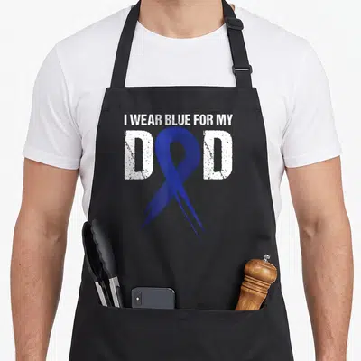 Blue cancer man apron - Distressed white text I WEAR BLUE FOR MY DAD with overlapping blue awareness ribbon — shown on a black cotton canvas apron against a white background
