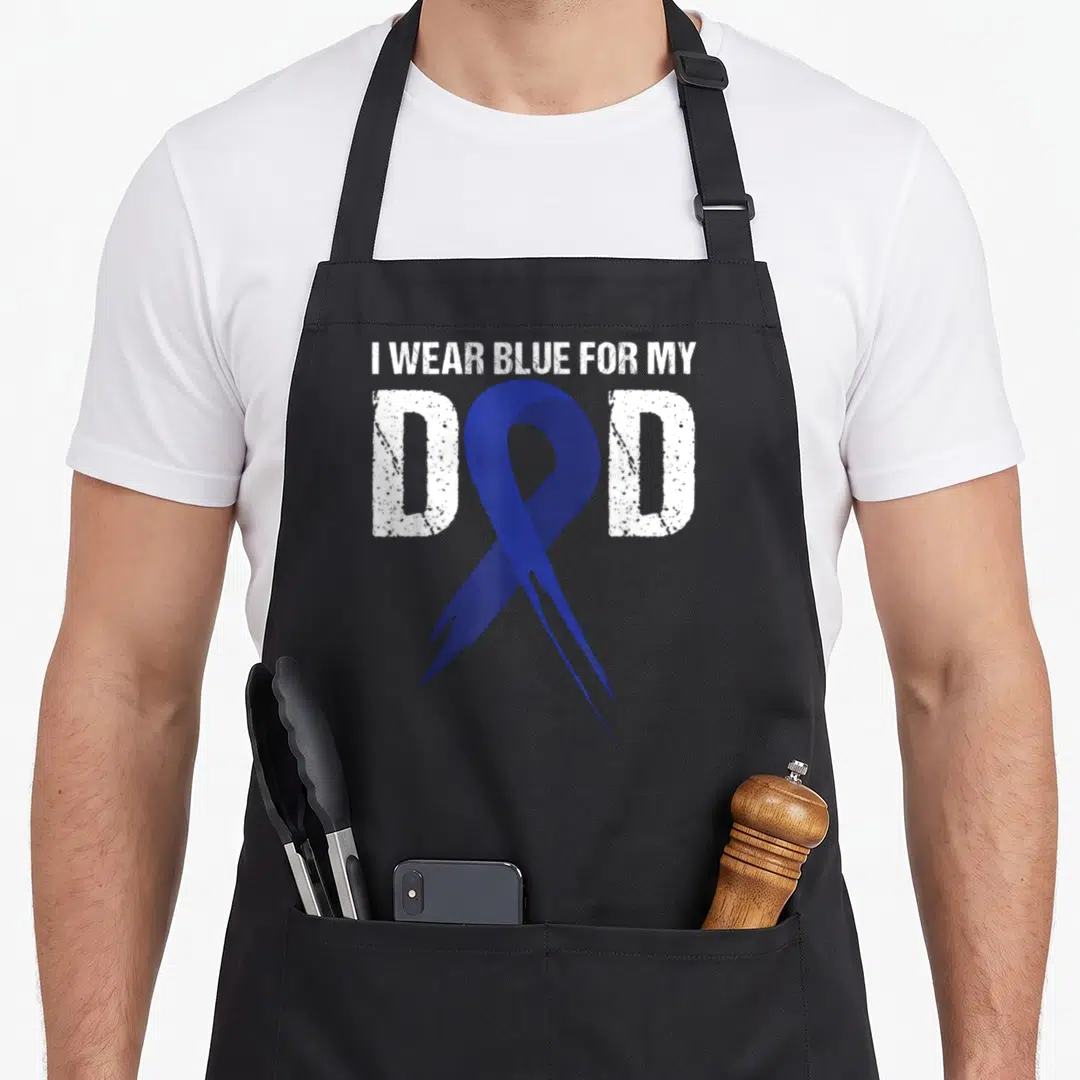 Blue cancer man apron - Distressed white text I WEAR BLUE FOR MY DAD with overlapping blue awareness ribbon — shown on a black cotton canvas apron against a white background