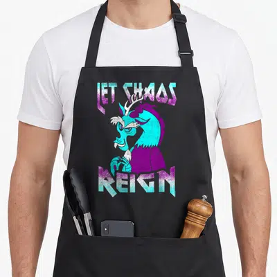 Chao magic apron - Cyan and purple dragon illustration between the text LET CHAOS REIGN — shown on a black cotton canvas apron against a white background
