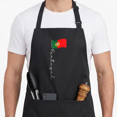 Signature portuguese apron - Green red white flag with vertical white Portugal script text — shown on a black cotton canvas apron against a white background