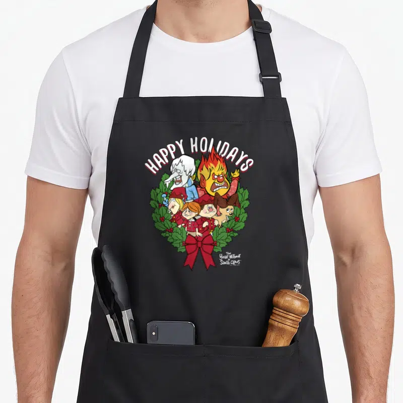 Wreath santa claus apron - Happy Holidays text over cartoon characters in green holly wreath with red bow — shown on a black cotton canvas apron against a white background