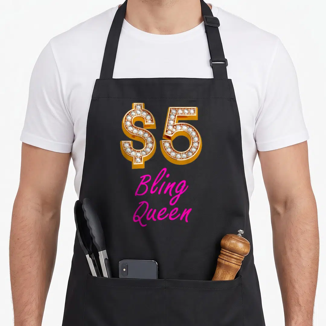 Bling jewelry apron - Gold diamond encrusted $5 symbol above pink Bling Queen script text — shown on a black cotton canvas apron against a white background