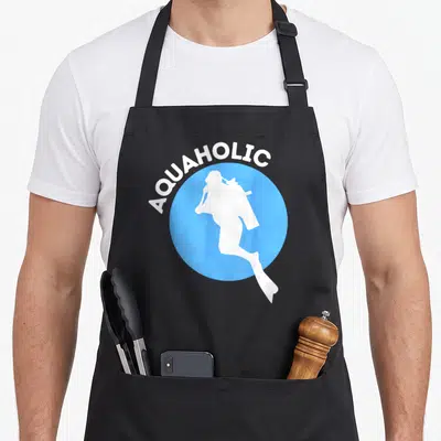 Aquaholic snorkeling apron - White diver silhouette in blue circle with arched text — shown on a black cotton canvas apron against a white background