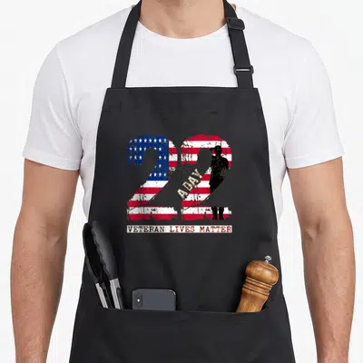 Veteran hand life apron - Two large 22s filled with US flag pattern and soldier silhouette — shown on a black cotton canvas apron against a white background