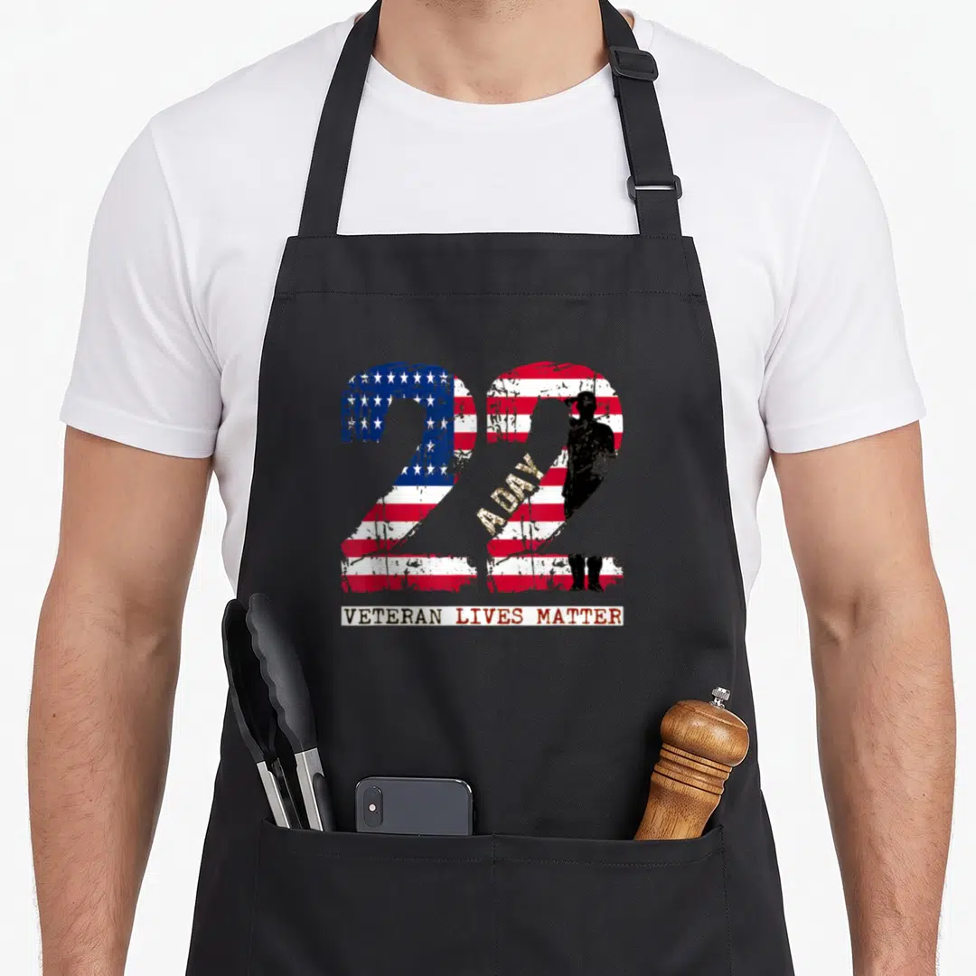 Veteran hand life apron - Two large 22s filled with US flag pattern and soldier silhouette — shown on a black cotton canvas apron against a white background