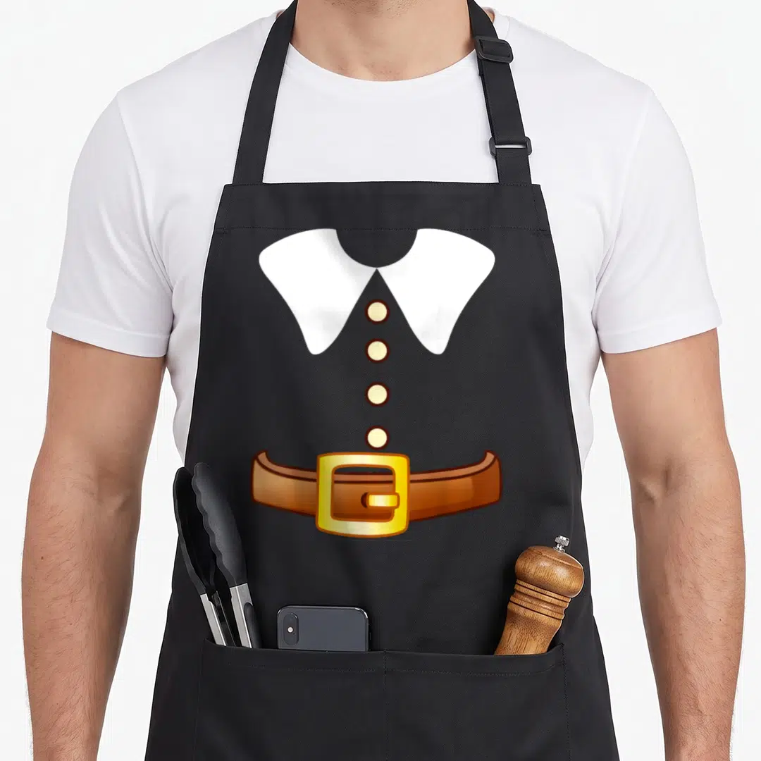 Thanksgiving costume pilgrim apron - Cartoon white collar, four yellow buttons, brown belt with yellow buckle on grey — shown on a black cotton canvas apron against a white background