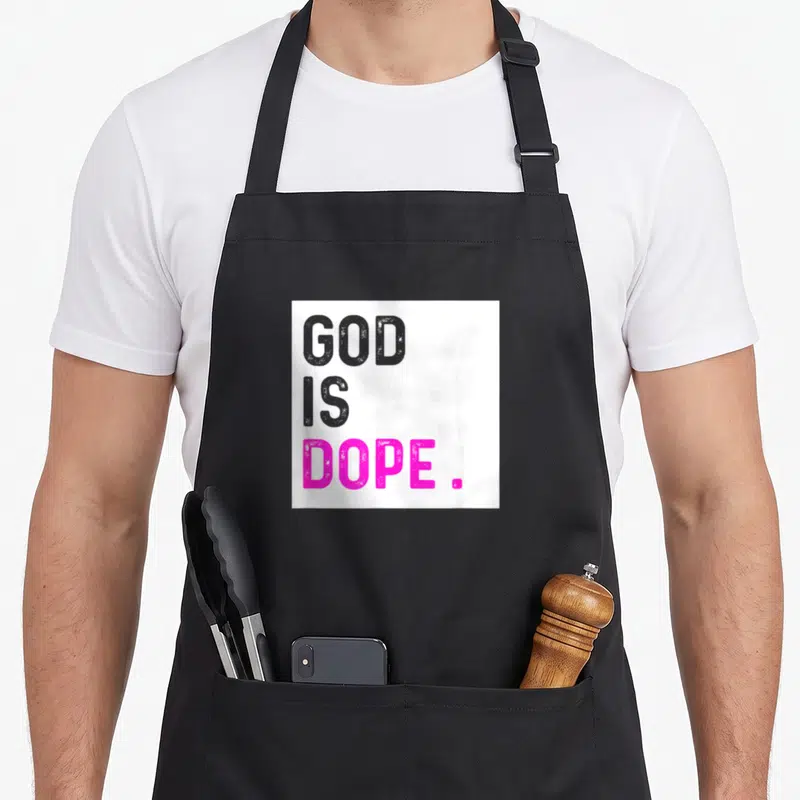 God funny christian aprons - Stacked text GOD IS DOPE in grey and pink on white background — shown on a black cotton canvas apron against a white background