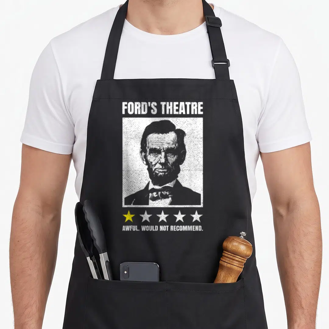 Abraham theatre apron - Lincoln portrait with Ford's Theatre text and one yellow star below — shown on a black cotton canvas apron against a white background