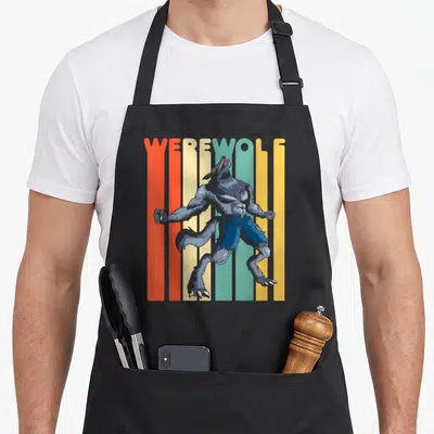 Werewolf halloween apron - Grey werewolf standing before red orange yellow and blue vertical stripes with WEREWOLF text — shown on a black cotton canvas apron against a white background