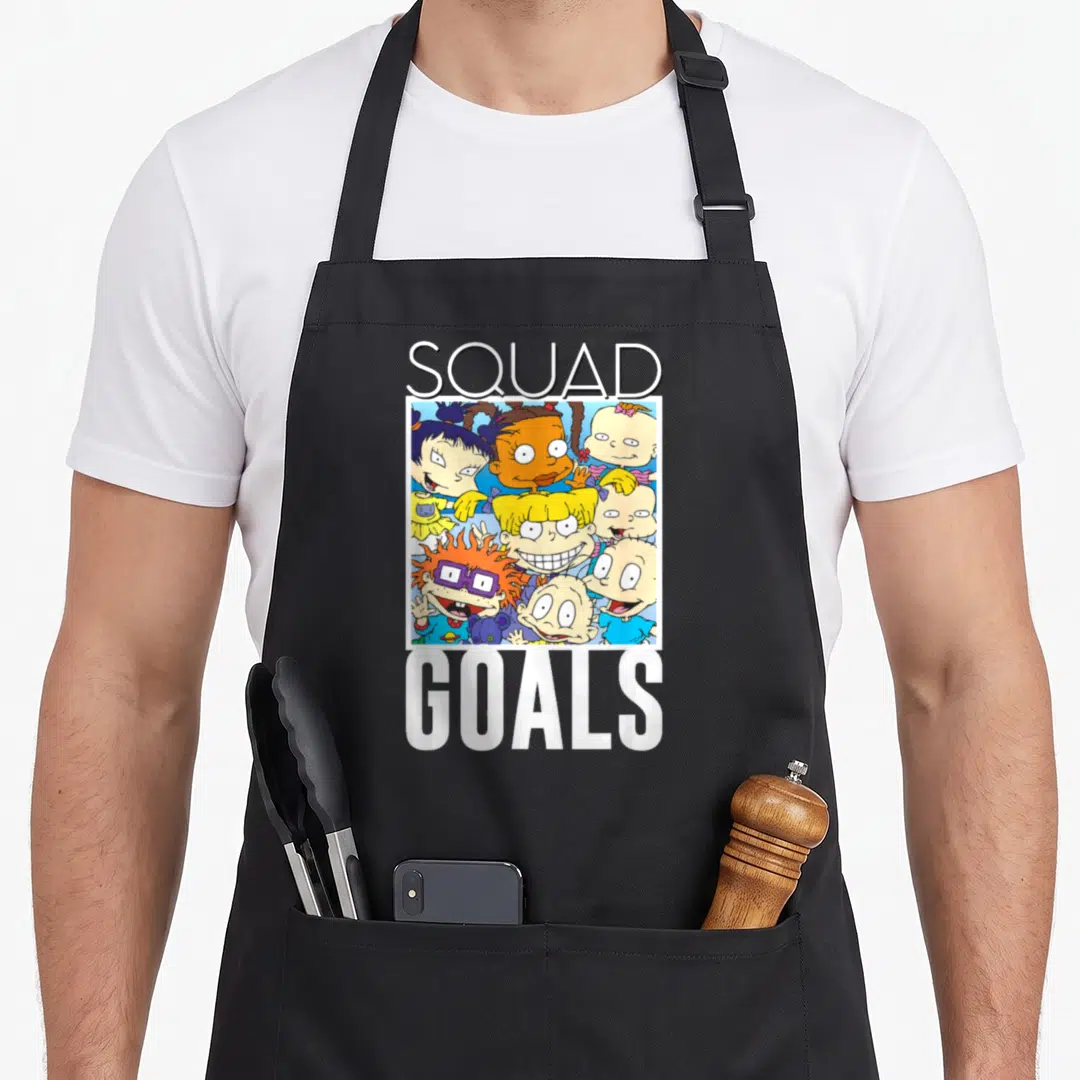 Goal squad apron - Rugrats character cluster between SQUAD and GOALS text in cartoon style — shown on a black cotton canvas apron against a white background
