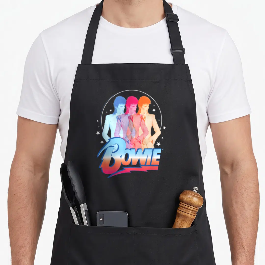 Vintage bowie david aprons - Three overlapping Bowie figures in blue pink orange within white circle with BOWIE — shown on a black cotton canvas apron against a white background