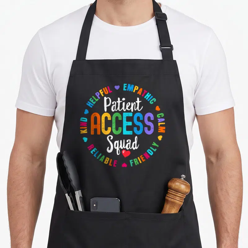 Access patient apron - Multi-colored ACCESS text between white Patient Squad script surrounded by helpful and kind — shown on a black cotton canvas apron against a white background