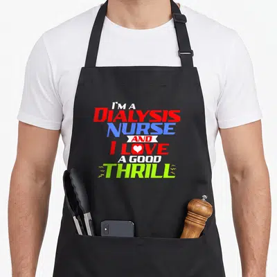 Thrill nurse apron - Stacked dialysis nurse text with white heart in love and lime green lightning bolts on red blue — shown on a black cotton canvas apron against a white background